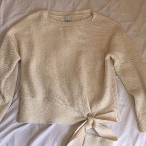 Chunky cream lower-front tie sweater